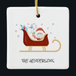 Personalisiert Fun Covid | Weihnachtsbaum Keramikornament<br><div class="desc">Dekorieren Sie Ihren Baum mit diesem lustigen Santa und seinem Schlitten, mit covid liefert lustige Weihnachtsbaumdekoration. Das Ornament hat Corona-Virus-Symbole als Schneeflocken und einen Schlitten voll von coviden essentials, Gewebe, Toilettenrollen, Thermometer, Gesichtsmaske, Seife und einem Hand-Sanitier in Santas Schlitten. Der Weihnachtsmann sitzt neben den Geschenken mit einer Gesichtsmaske. Im Text...</div>