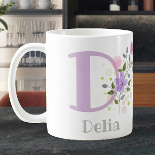 Personalisierte Blumencoffee Tasse mit Name Delia.