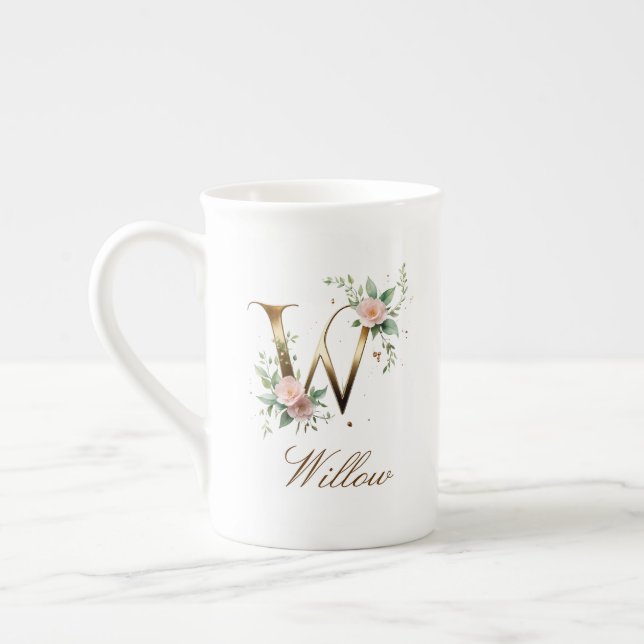 Personalisierte goldene Blumenmonogramm-Initiale W Prozellantasse (Links)