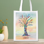 Personalisierter Regenbogenbaum Wiederverwendbare Einkaufstasche<br><div class="desc">Diese wiederverwendbaren Lebensmitteltaschen sind mit einem Mosaikbaum in den Farben des Regenbogens auf einem Aquarell dekoriert. Einfach mit Ihrem Namen erreichbar. Verwenden Sie die Option Weitere anpassen, um die Textgröße, den Stil oder die Farbe zu ändern, wenn Sie möchten. Weil wir unsere eigenen Kunstwerke erstellen, werden Sie dieses exakte Bild...</div>