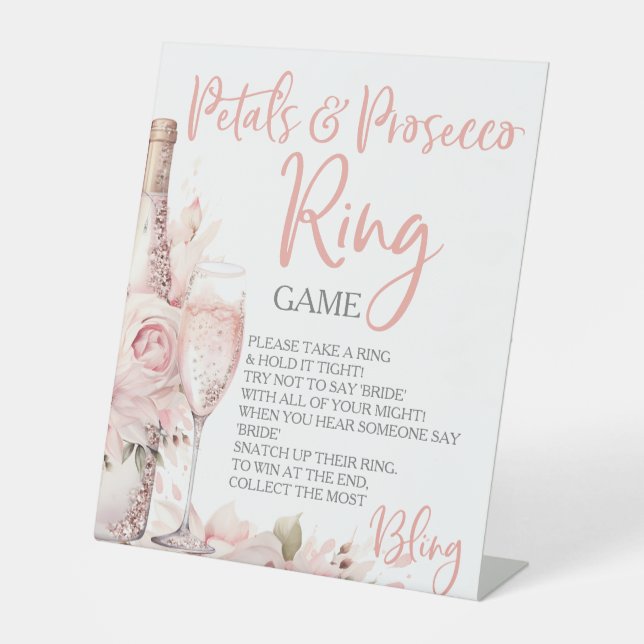 Petals & Prosecco Ring Game Hour Rings Sockelschild (Vorderseite)