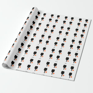Pickleball-Paddel und orangefarbenes Pickleball Geschenkpapier