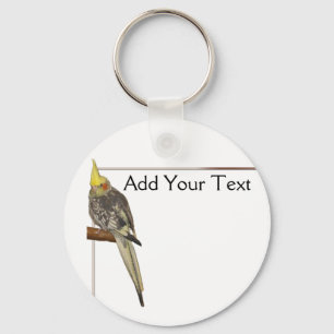 Pied Cockatiel auf einem Zweig mit Weiß Schlüsselanhänger