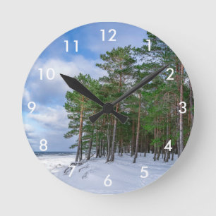 Pine forest near sea coast in Latvia Runde Wanduhr