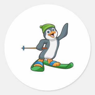 Pinguin als Skier mit Ski & Cap Runder Aufkleber
