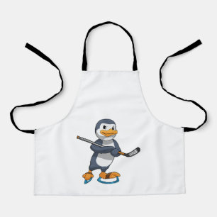 Pinguin beim Eishockey mit Eishockeyschläger Schürze