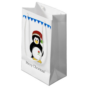 Pinguin in einem Weihnachtsmannhut Kleine Geschenktüte