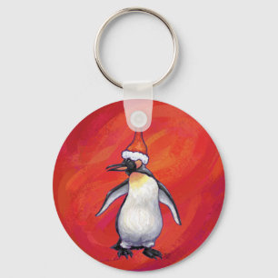 Pinguin in Weihnachtsmannmütze auf Rot Schlüsselanhänger