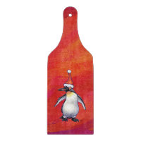 Pinguin in Weihnachtsmannmütze auf Rot