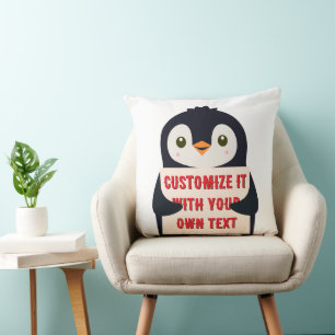Pinguin-Maskottchen hält ein Schild für benutzerde Kissen