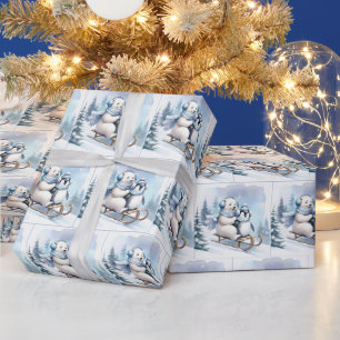 Pinguin und Eisbär auf einem Schlitten Geschenkpapier