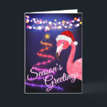 Pink Flamingo Festive Tropical Beach Weihnachten<br><div class="desc">Die Grüße tropischen Strand Weihnachtsgrüße dieser Saison hat eine rosa Flamingo mit einer rot-weißen Weihnachtsmannmütze. Es gibt festliche Weihnachtsliegeleuchten und einen Weihnachtsbaum von Ribbon und Sternen. Innen Gruß ~ "Herzliche Wünsche von unserem Urlaubsparadies zu Ihren". ^</div>