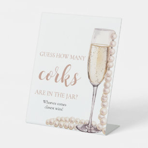 Pink Pearls und Prosecco schätzen, wie viele Corks Sockelschild