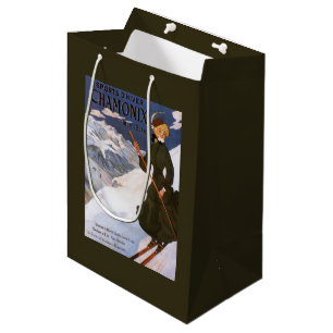 Plakat einer Frau im grünen Skianzug Mittlere Geschenktüte