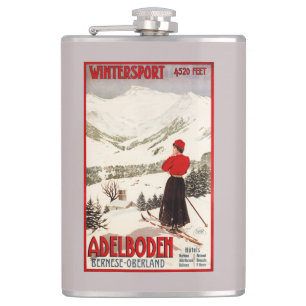 Plakat mit Skifahrerin mit Blick auf Adelboden Flachmann