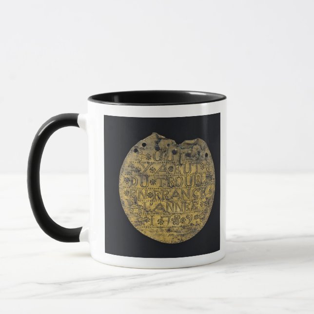 Plakette mit der Phrase Tasse (Links)