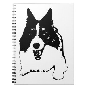 Pläne neben einem Corgi Notizblock