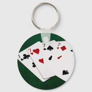 Poker Hände - vier von einer Art - sieben und zwei Schlüsselanhänger