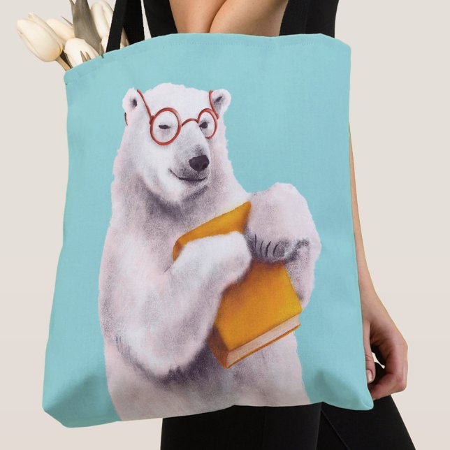 Polar Bear Book Lover Nerdy (close up of a blue tote bag with polar bear book lover with eyeglasses and yellow book)