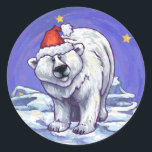 Polar Bear Christmas Runder Aufkleber<br><div class="desc">Tierparade Festive Polar Bären Sticker bieten unsere lustige Kunstwerke eines niedlichen Eisbären, der alle für die Ferien in einer roten Weihnachtsmannmütze, stehend in einer verschneiten Landschaft, gegen einen strukturierten dunkelblauen Sternenhimmel, der von unserem talentierten Kinderbuch-Illustrator Traci Van Wagoner gemalt wurde, verziert wurde. Wenn man Eisbären und Weihnachten Liebe, will man,...</div>
