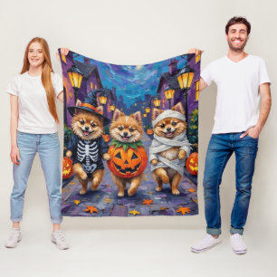 Pomeranian-Süßigkeitenbetteln in Halloween-Kostüme Fleecedecke