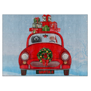 Poodle Hund in Auto mit dem Weihnachtsmann Schneidebrett