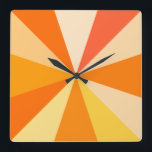 Pop Art Modern 60er Funky Geometric Rays in Orange Quadratische Wanduhr<br><div class="desc">Diese angesagte,  Retro-60er-inspiriert Pop-Kunsttakt hat psychedelisch orangefarbene Strahlen / Sonnenaufgänge,  die in einem geometrischen Muster ausschießen. Es gibt zwölf Strahlen,  um die Zeit zu markieren - kein Bedarf für Zahlen auf dieser funky,  minimalistischen,  ultra-Mod Uhr. Es ist groovy,  Baby.</div>