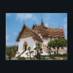 Postcard of a scenic temple in Thailand Postkarte<br><div class="desc">Photo of a dazzling white temple under a blue sky. The temple,  in the heart of Thailand,  has gold trimmings and traditional Thai architecture  It is surrounded by trees. Stairs lead to one of the entrances. The roof is red and Thai art adorns the outside of the temple.</div>