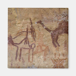 Prähistorische Felsmalereien mit Kamelen und Magnet