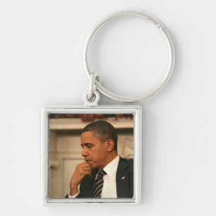 Präsident Barack Obama reflektiert sich, während Schlüsselanhänger
