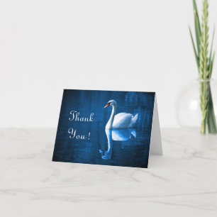 Pretty white swan floating on blue lake dankeskarte