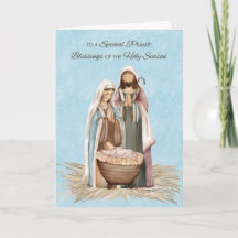 Priester Weihnachts-Segnungen dank Krippe Szene