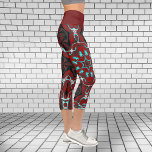 Psychedelische Hippie-Leggings Capri Leggings<br><div class="desc">Diese psychedelischen Leggings sind in einem asymmetrischen Kaleidoskop-Muster tief rot und hell aquamarin.</div>