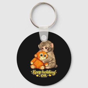 Punch-Affe mit Teddybär kuschelt und hält weiter f Schlüsselanhänger
