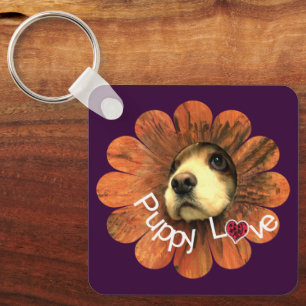Puppy-Liebe-Peeking aus einer Blume Schlüsselanhänger