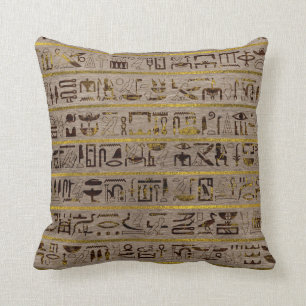 Pyrographed goldene ägyptische Hieroglyphen auf Kissen