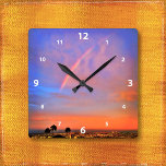 Rainbow-Orangenblau-Sonnenuntergang Himmelslandsch Quadratische Wanduhr<br><div class="desc">Erleben Sie die Schönheit der Natur, wann immer Sie die Zeit auf dieser fotografischen Wanduhr eines Regenbogens in einem blauen, rosa und orangefarbenen, sanft beleuchteten Sonnenuntergang Karo haben. Ihre Wahl einer rund oder quadratisch gedrehten Uhr. Macht ein großartiges Geschenk für die Hauswärmung! Sie können diese Wanduhr leicht personalisieren und ich...</div>