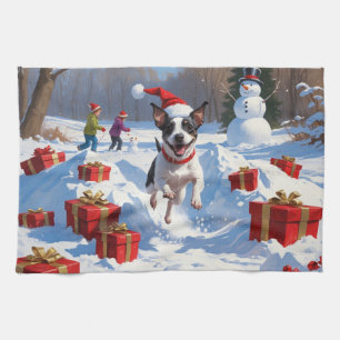 Ratt Terrier läuft im Schnee mit Weihnachtsmütze Geschirrtuch