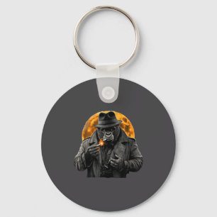 Rauchender Gorilla im Trenchcoat mit orangefarbene Schlüsselanhänger