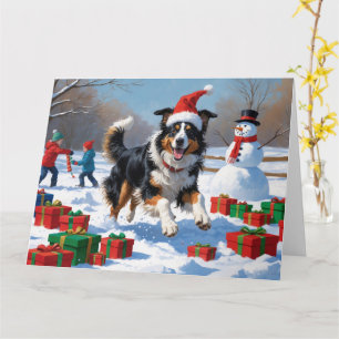 Raucollie läuft im Schnee mit Weihnachtsmütze Karte
