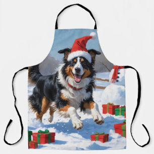 Raucollie läuft im Schnee mit Weihnachtsmütze Schürze