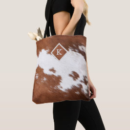 Realistic brown and white cowhide texture monogram