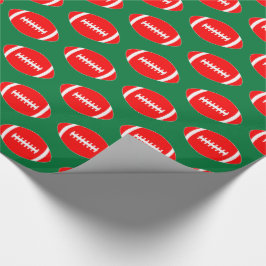 Red Footballs auf Green Background Weihnachtsgesch Geschenkpapier