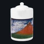 Red Fuji, Aka Fujiyama Volcano Katsushika Hokusai<br><div class="desc">Die Szene aus dem japanischen Holzschnitt "Fine Wind, Clear Morning" (auch bekannt als "Red Fuji" oder "Aka Fuji") ist eine atemberaubende Darstellung des Fuji, der in den lebhaften Farben des Sonnenaufgangs gebadet wird. Dieses Kunstwerk ist Teil von Katsushika Hokusais berühmter Serie "36 Ansichten des Fuji", die zwischen 1830 und 1832...</div>