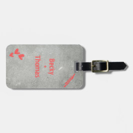 Red graffiti name on gray concrete, your gepäckanhänger