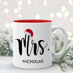 Red Santa Hat Custom Holiday Monogram Zweifarbige Tasse<br><div class="desc">Christmas holiday mug feature Mrs in modern black script with your custom last name. Beim Red Santa Hat Accents the Design. Perfect gift for a newly wed drehmoment celebrating their first married Christmas! Visit our store for the matching Mr Holiday Mug.</div>