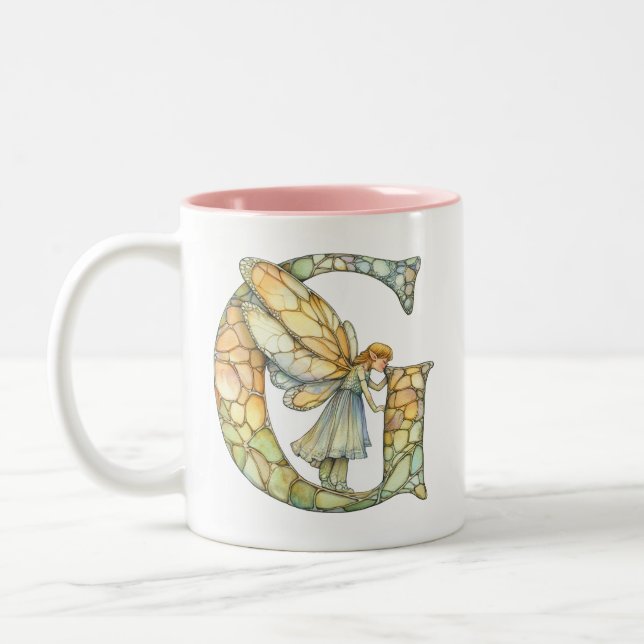 Regenbogenfee Initiale 'G'  Zweifarbige Tasse (Links)