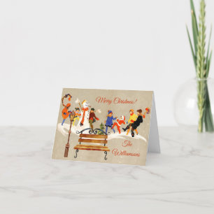 Reizende Vintage-Kinder spielen im Schnee Feiertagskarte