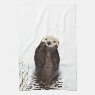 Reizender lächelnder Otter im See Geschirrtuch