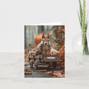 Reizendes Eichhörnchen mit winzigem Holzwagen Feiertagskarte